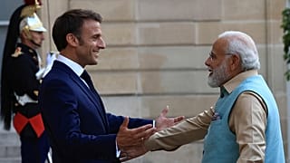 French President Emmanuel Macron welcomes Indian Prime Minister Narendra Modi before a working dinner, Thursday, July 13, 2023 at the Elysee Palace, in Paris.