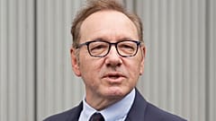 Actor Kevin Spacey looks on as he arrives at Southwark Crown Court, London