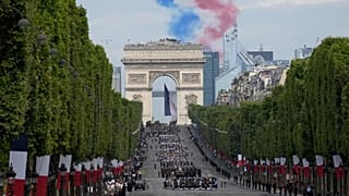 Alphajets of the Patrouille de France fly over the Champs-Elysees avenue during the Bastille Day parade.
