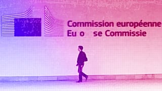 A man walks outside the European Commission headquarters in Brussels, July 2013
