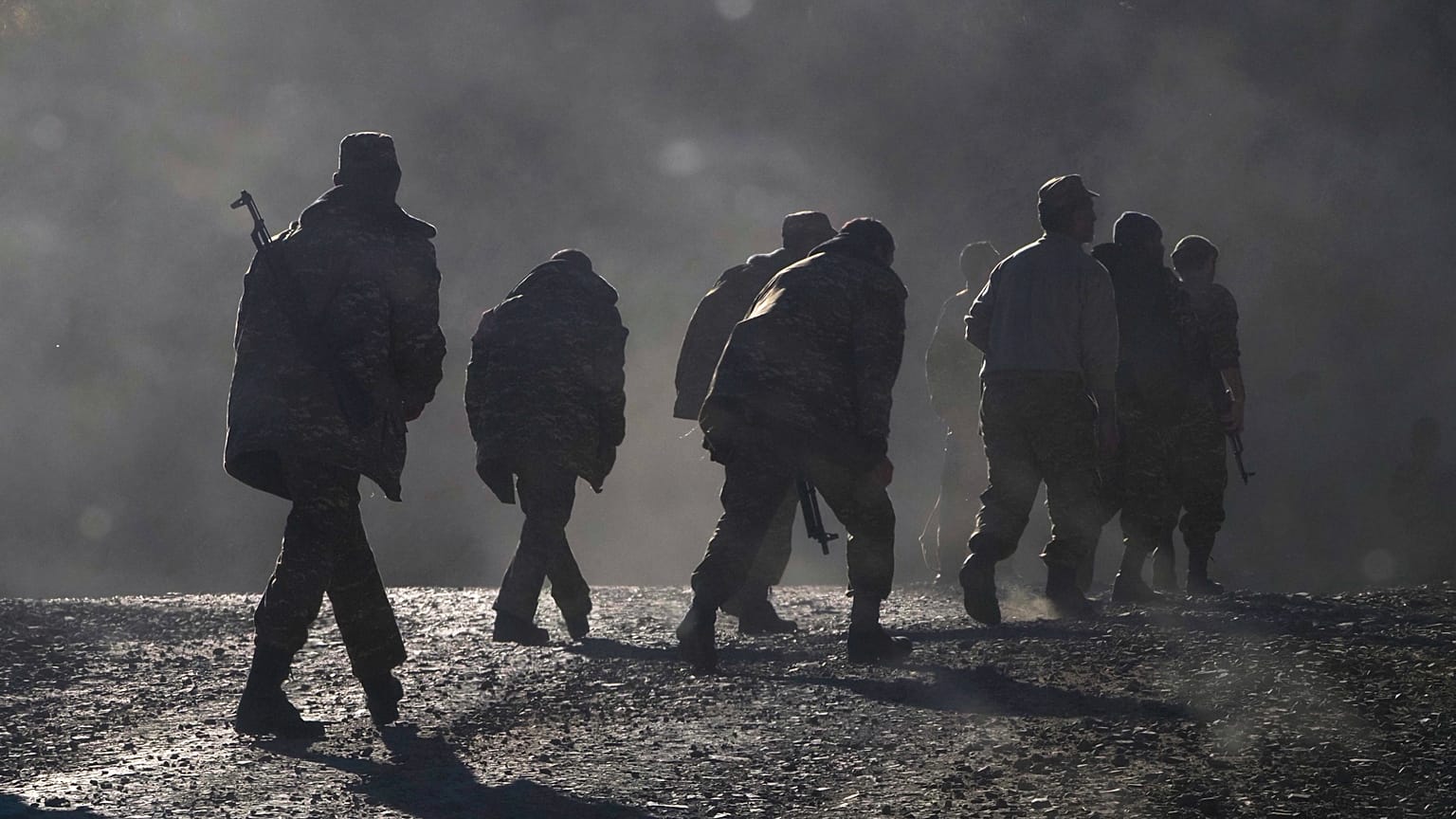  Ethnic Armenian soldiers walk along the road near the border between Nagorno-Karabakh and Armenia
