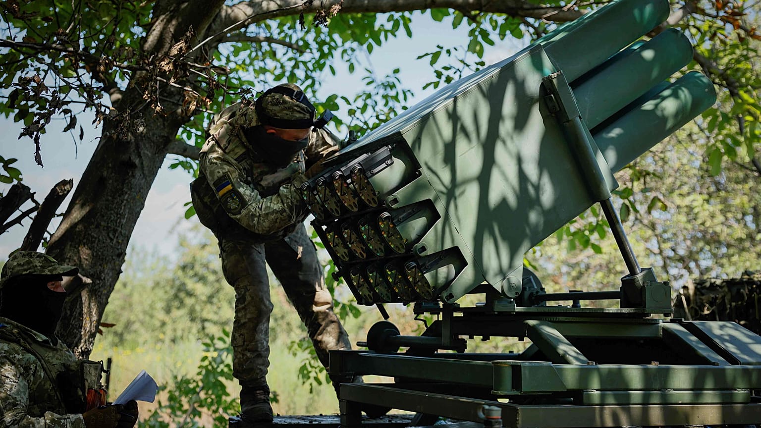 A Ukrainian soldier prepares a Croatian RAK-SA-12 128mm multiple rocket launcher to fire towards the Russian positions. Monday, July 10, 2023. 