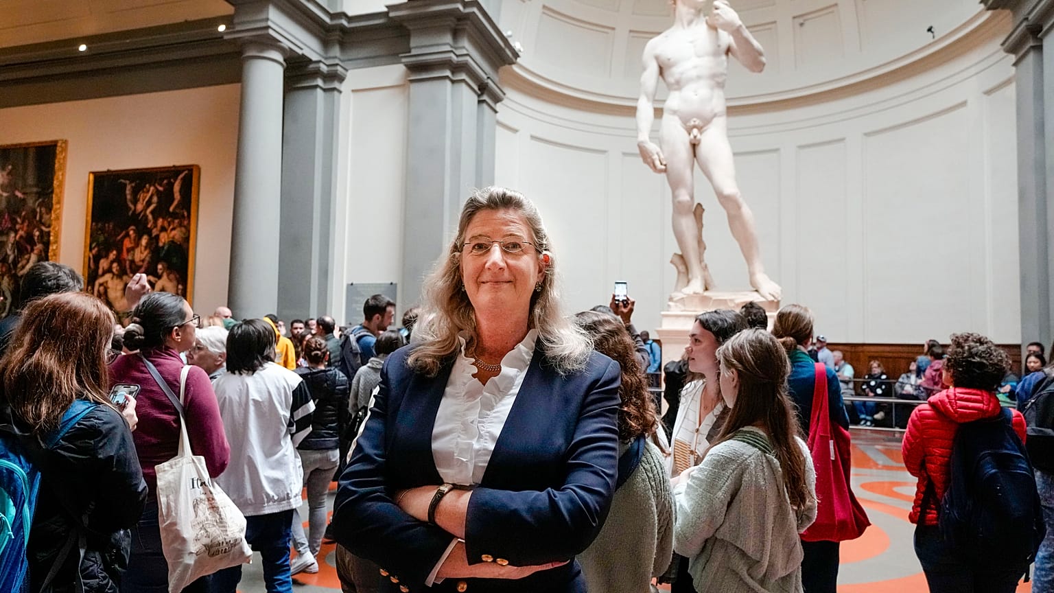 Cecilie Hollberg, director of the Accademia Gallery poses in front of Michelangelo's white marble statue "David" in Florence.