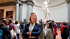 Cecilie Hollberg, director of the Accademia Gallery poses in front of Michelangelo's white marble statue "David" in Florence.