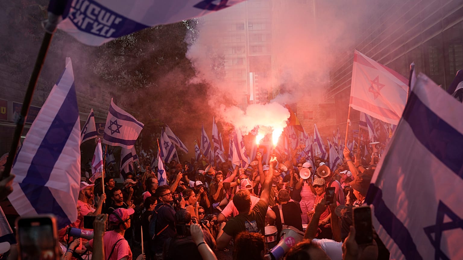 Israelis protest against plans by Prime Minister Benjamin Netanyahu's government to overhaul the judicial system in Tel Aviv, Israel, Tuesday, July 18, 2023.
