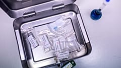 A sample of a "Blue Punisher" Ecstasy Pill, along with other drug samples are stored in a box at Berlin's forensic medicine department in Berlin, Germany, July 10, 2023.