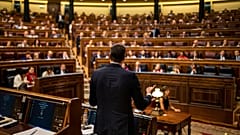 rime Minister Pedro Sánchez, center, gives a reply to United Podemos (United We Can) party leader Pablo Iglesias during the parliamentary debate at the Spanish parliament.