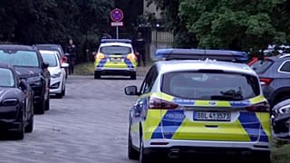 Police patrol during a search operation for a dangerous wild animal near the village of Kleinmachnow in the southern suburbs of Berlin, Germany.