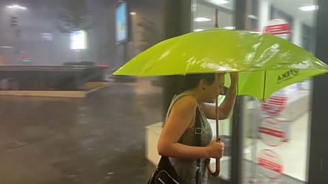 Pedestrian with umbrella. 