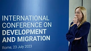 Italian Premier Giorgia Meloni, waits for guests to arrive at an International conference on migration in Rome, Sunday, July 23, 2023.