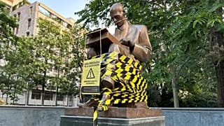 The statue of journalist Indro Montanelli with black and yellow tape