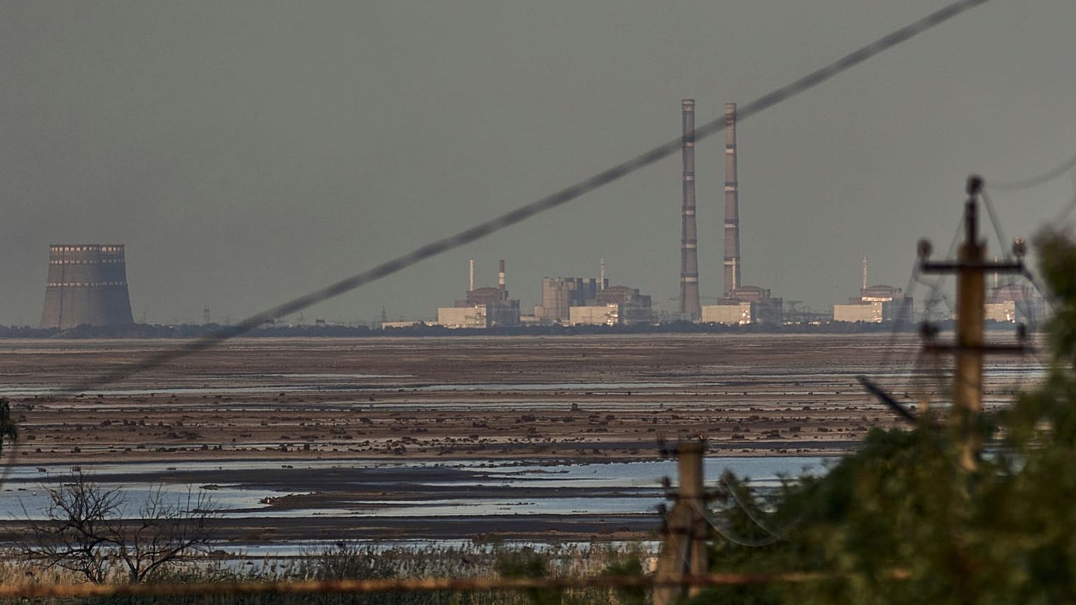 The Zaporizhzhia nuclear power plant, Europe's largest, is seen in the background of the Kakhovka Reservoir.