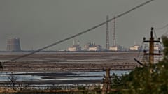 The Zaporizhzhia nuclear power plant, Europe's largest, is seen in the background of the Kakhovka Reservoir.