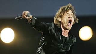 Mick Jagger performs during the Rolling Stones concert at the San Siro stadium in Milan, Italy, Tuesday, July 11, 2006.