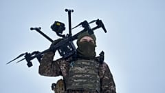 A Ukrainian soldier carries a drone close to the frontline near Avdiivka, Donetsk region, Ukraine, Friday, Feb. 17, 2023. 