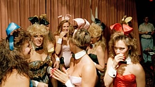 Unidentified Playboy bunnies congregate at closing time on the last night of business in Lansing