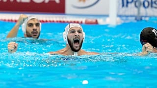 Greece's Konstantinos Genidounias celebrates after scoring a goal against Hungary during their men's water polo gold medal match at the World Swimming Championships in Fukuoka