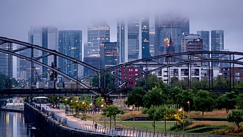 Clouds hang over the buildings of the banking district in Frankfurt, Germany, Friday, July 28, 2023. 