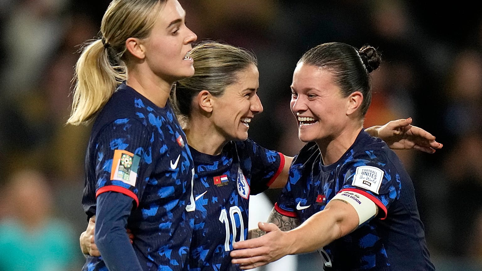 Danielle Van de Donk celebrates with Sherida Spitse and Jill Roord.