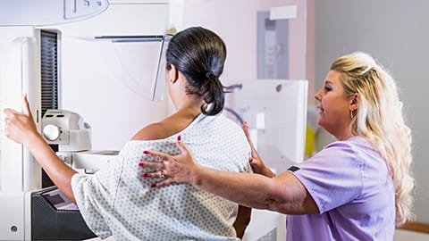 A woman gets a mammogram to screen for breast cancer