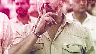 Vox far right party leader Santiago Abascal asks for silence before listening the Spanish national anthem during an election campaign event in Guadalajara, July 2023