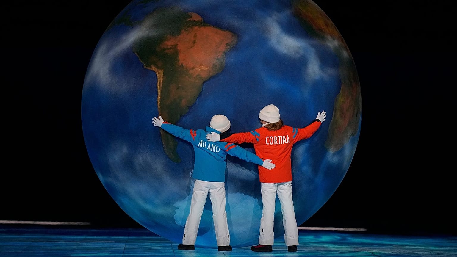 Children representing Cortina and Milan perform during the closing ceremony of the 2022 Winter Olympics, Sunday, Feb. 20, 2022, in Beijing.