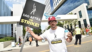 Adam Shapiro poses on a picket line outside Netflix studios on Tuesday, Aug. 1, 2023, in Los Angeles.
