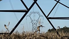 Electricity poles are seen in the countryside outside Lyon, central France, Sept. 12, 2022.