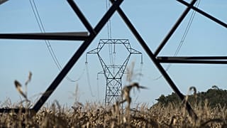 Electricity poles are seen in the countryside outside Lyon, central France, Sept. 12, 2022.