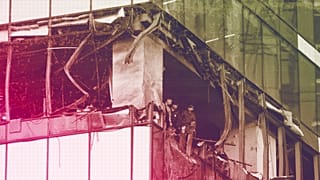 Investigators examine a damaged skyscraper in the "Moscow City" business district after a reported drone attack in Moscow, 30 July 2023