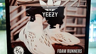 A sign advertises Yeezy shoes made by Adidas at Kickclusive, a sneaker resale store.