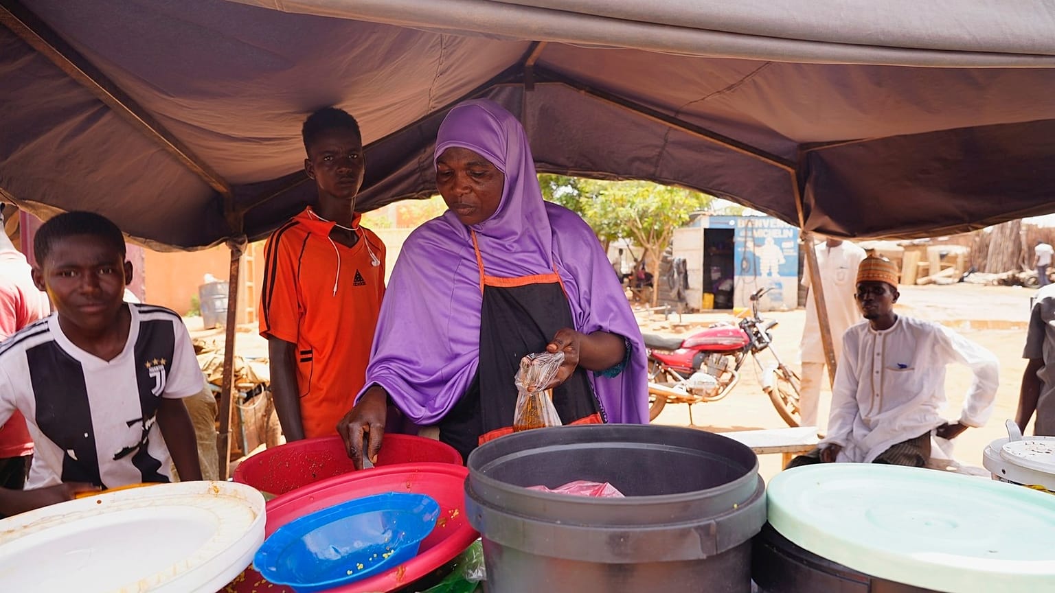 A woman prepares food in Niamey, Niger, Saturday, July 29, 2023.