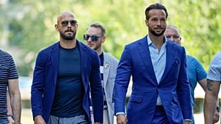 FILE: Andrew Tate, left, and his brother Tristan, arrive flanked by bodyguards, at the Bucharest Tribunal in July 2023