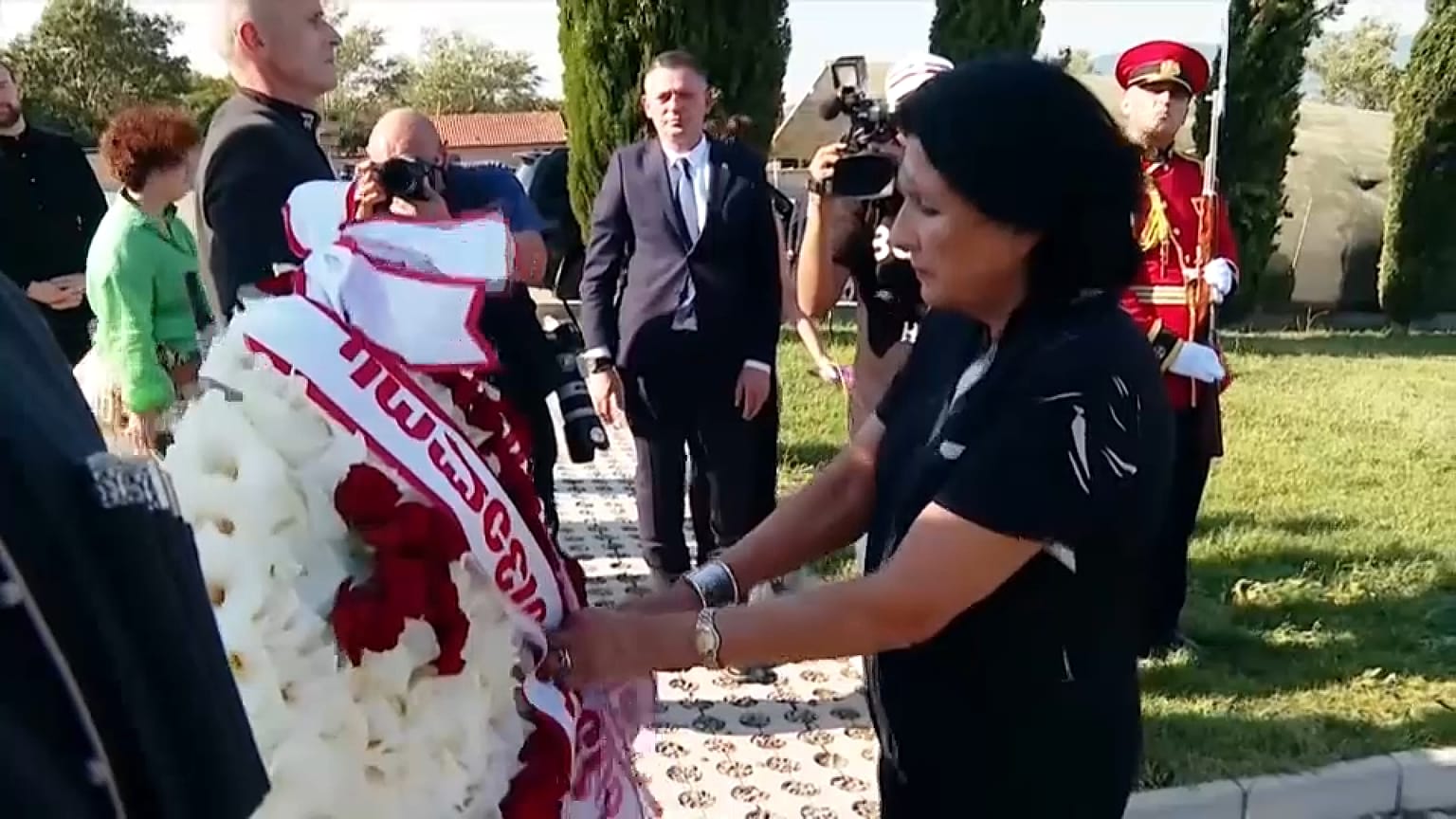 Georgian President Salome Zourabichvili bows head in tribute to soldiers killed during Russo-Georgian war of 2008, August 8, 2023