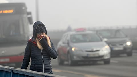 A girl walks across a bridge in Belgrade, Serbia, Wednesday, Jan. 15, 2020
