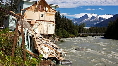 Collapsed house on riverside.