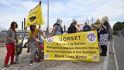 Protesters outside the barge.
