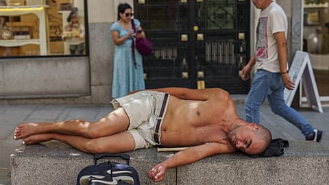 A man rests during a hot and sunny day of summer in Madrid, Spain, July 19, 2023.