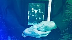 Holocaust survivor Peter Stein holds a photograph of his grandparents during the 2023 Days of Remembrance commemoration, Washington DC, April 2023