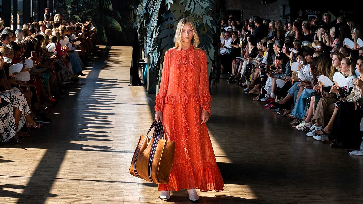A model displays a creation during the Munthe fashion show, part of Copenhagen Fashion week, at Skuespilhuset in Copenhagen, Thursday, Aug. 9, 2018.