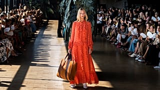 A model displays a creation during the Munthe fashion show, part of Copenhagen Fashion week, at Skuespilhuset in Copenhagen, Thursday, Aug. 9, 2018.