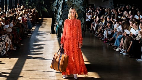A model displays a creation during the Munthe fashion show, part of Copenhagen Fashion week, at Skuespilhuset in Copenhagen, Thursday, Aug. 9, 2018.