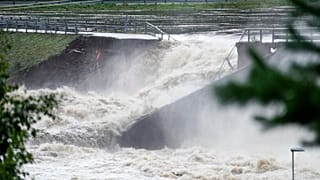 Water breaks through the dam at Braskereidfoss, Norway, on Wednesday.