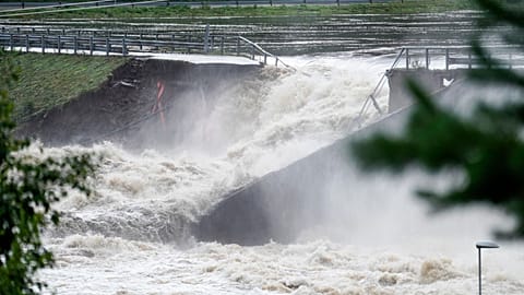 Water breaks through the dam at Braskereidfoss, Norway, on Wednesday.