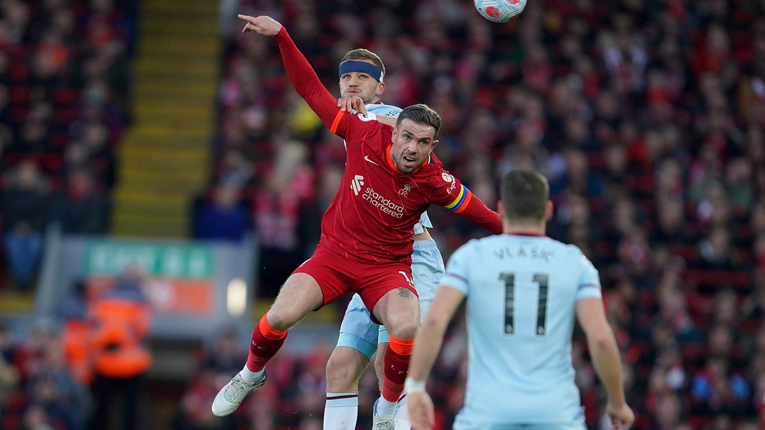 Jordan Henderson, centre, playing in an English Premier League match between Liverpool and West Ham United.