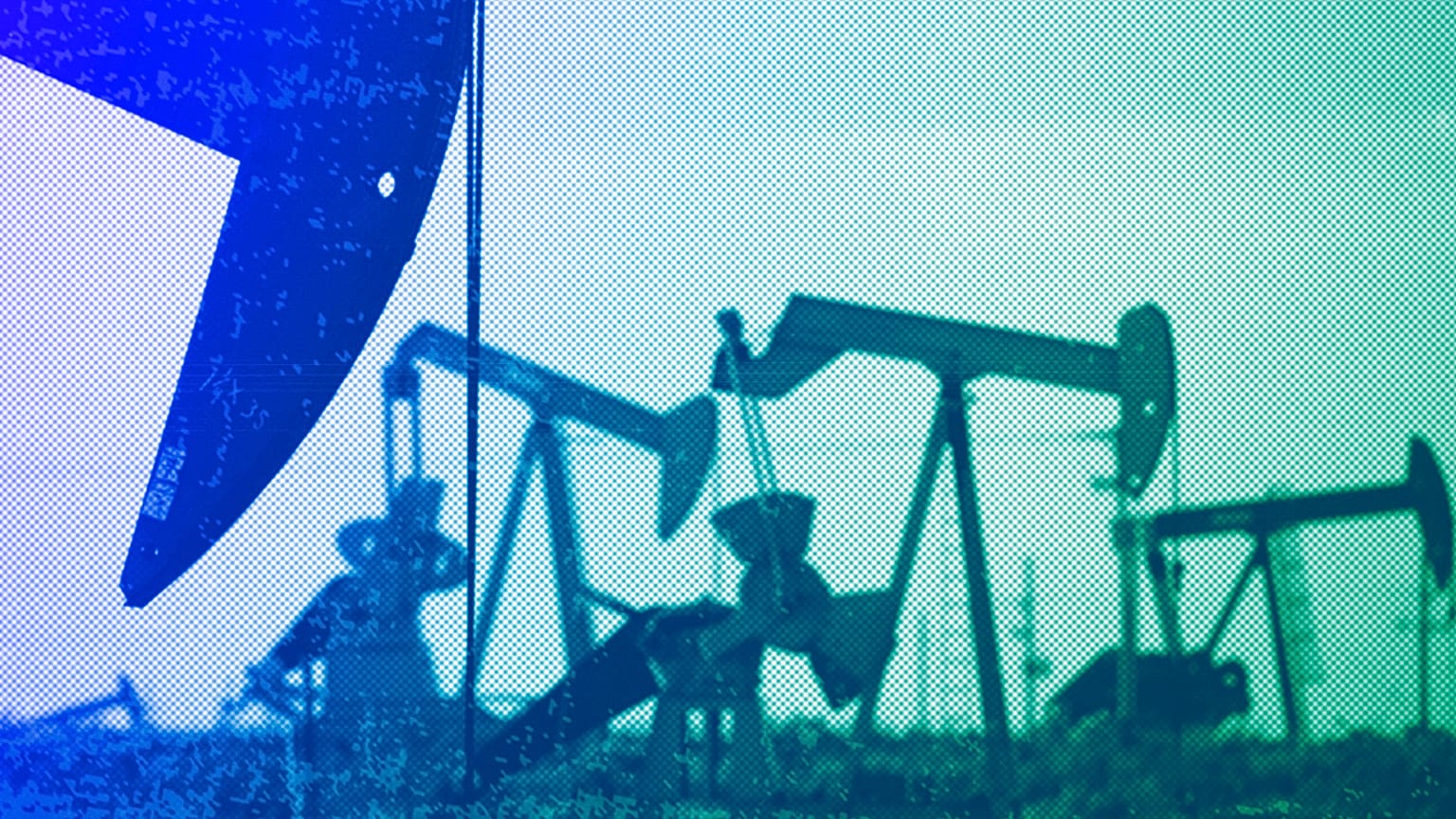 Pumpjacks work in a field near Lovington, NM, April 2015