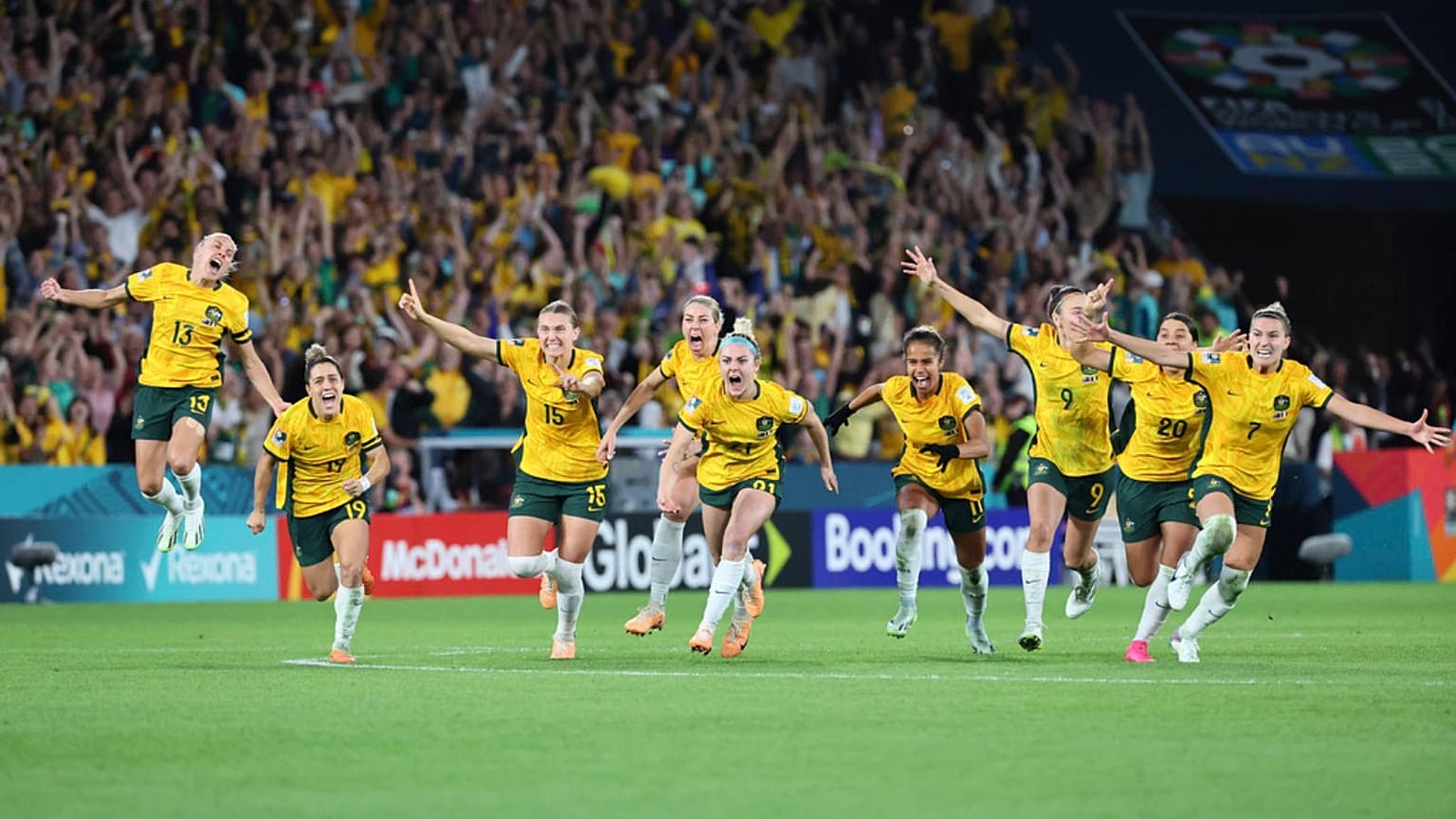 Australia players celebrate after winning the Women's World Cup quarterfinal 