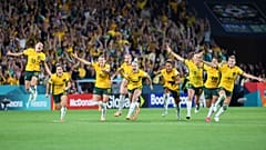 Australia players celebrate after winning the Women's World Cup quarterfinal 