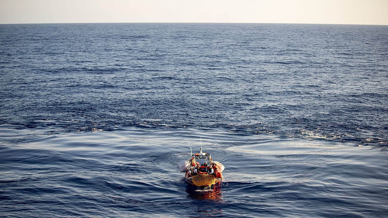 Migrants are carried by a Médecins Sans Frontières rescue team boat after being rescued in the Mediterranean Sea, Monday, Aug. 7, 2023.