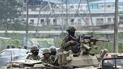 Armored vehicles enter the Deprivation of Liberty Center of the Zone 8 in Guayaquil, Ecuador, Saturday, Aug. 12, 2023.
